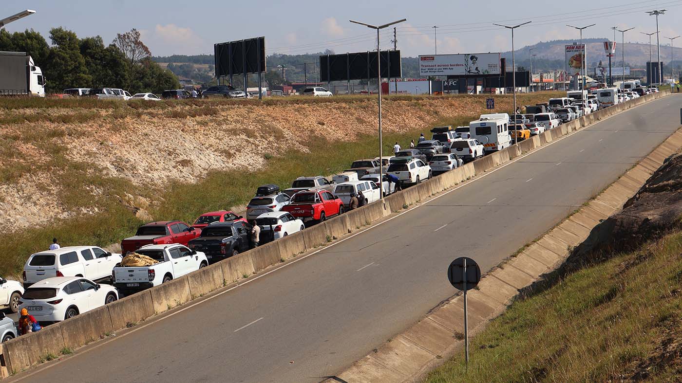 Frustrated travellers spend up to four hours in queues